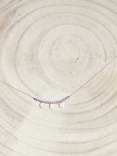 Cargar imagen en el visor de la galería, Collar oro monedas lila, monedas turcas en oro mate de 10x7mm y cristal lila 2mm con cadena sencilla 0,7 mm bañada en oro y 37 cm de largo con extensión.